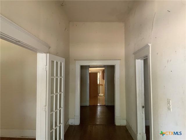 corridor featuring dark hardwood / wood-style floors