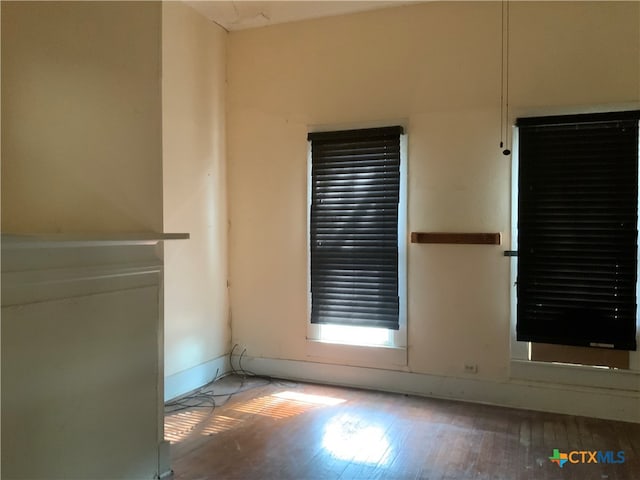 spare room featuring hardwood / wood-style flooring