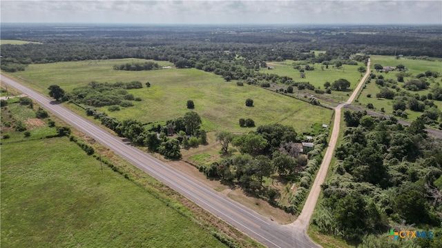 birds eye view of property with a rural view