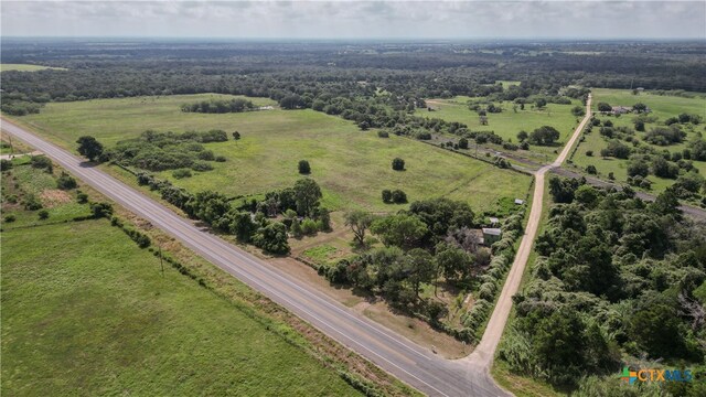 birds eye view of property with a rural view
