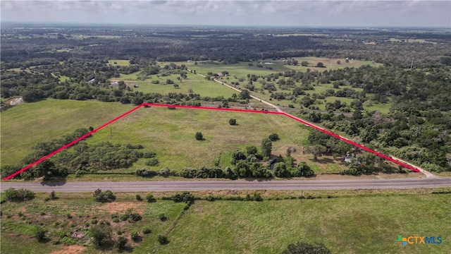 birds eye view of property with a rural view