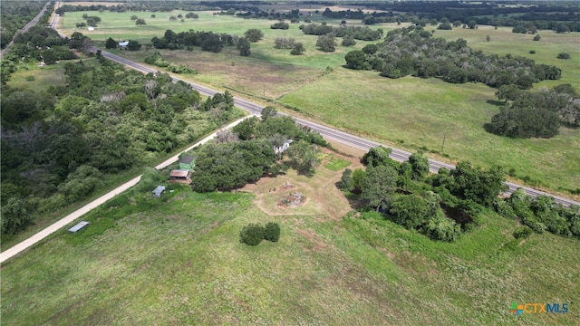 birds eye view of property featuring a rural view