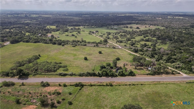 birds eye view of property with a rural view