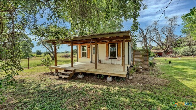 view of outbuilding featuring a yard