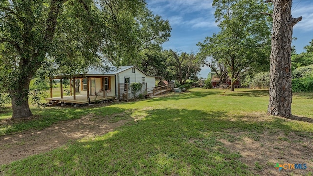 view of yard featuring a deck