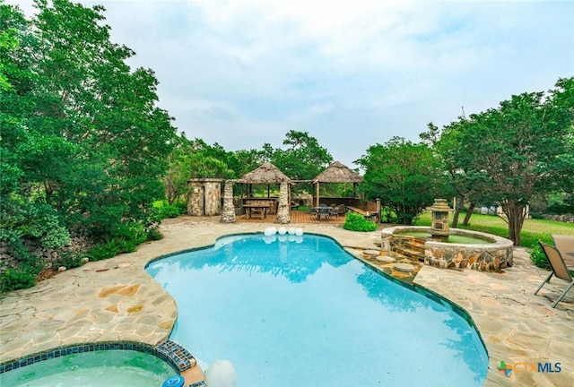 1218 Oakwood Loop, San Marcos, TX 78666 - view of pool featuring a gazebo, a pool with connected hot tub, and a patio area