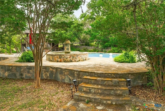 1218 Oakwood Loop, San Marcos, TX 78666 - view of swimming pool with a patio area