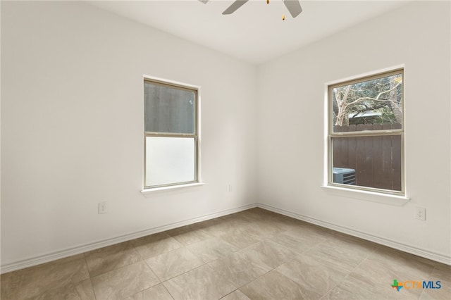 spare room featuring ceiling fan