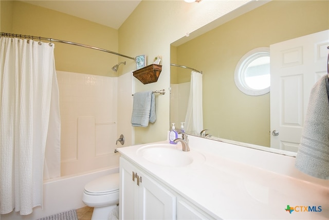 full bathroom with toilet, shower / bath combo with shower curtain, vanity, and tile patterned flooring