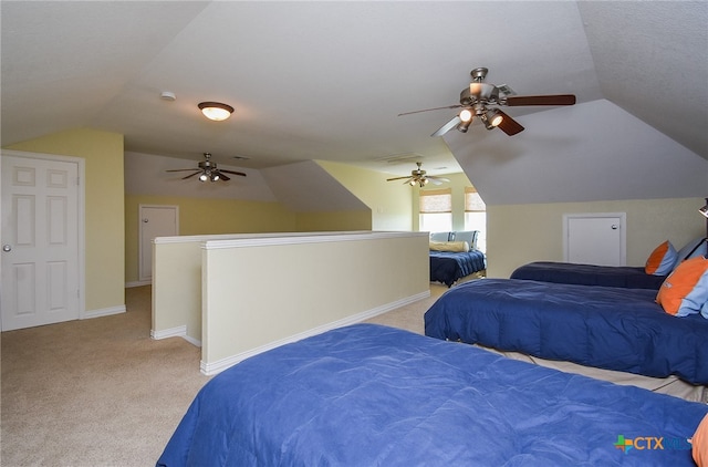 bedroom featuring ceiling fan, light carpet, and vaulted ceiling