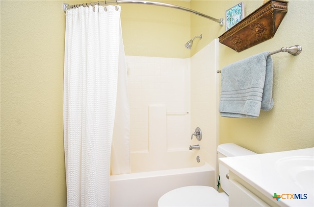 full bathroom with shower / tub combo, vanity, and toilet