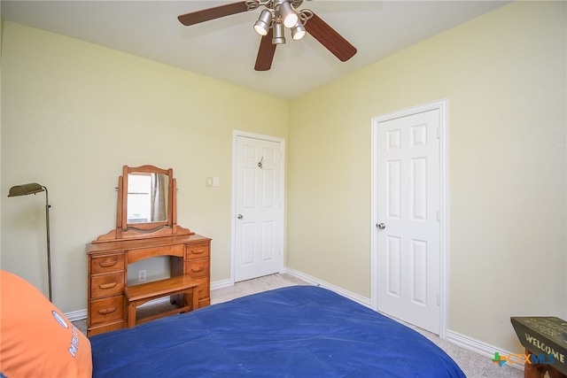 carpeted bedroom with ceiling fan