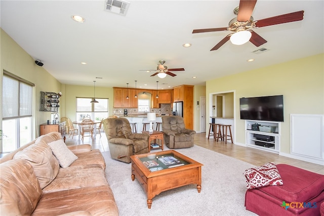 tiled living room featuring built in features