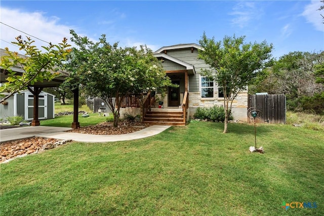 182 Palm, Spring Branch, TX 78070 - view of front facade with a shed, a front yard, stone siding, and a porch