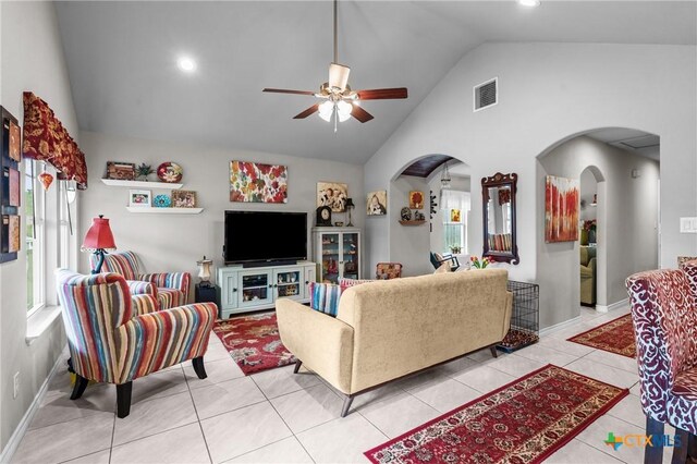 182 Palm, Spring Branch, TX 78070 - living room featuring ceiling fan, arched walkways, light tile patterned flooring, and high vaulted ceiling