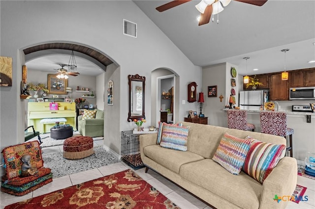 182 Palm, Spring Branch, TX 78070 - living area featuring a ceiling fan, arched walkways, light tile patterned flooring, and high vaulted ceiling