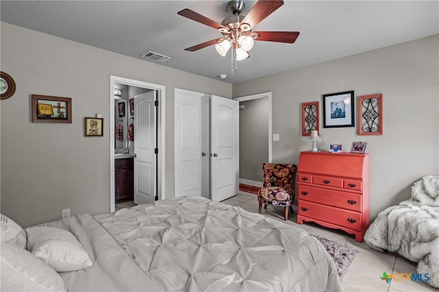 182 Palm, Spring Branch, TX 78070 - tiled bedroom with ensuite bathroom and ceiling fan