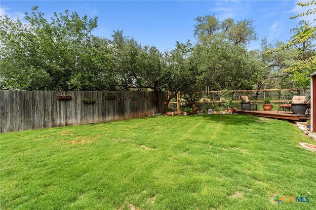 182 Palm, Spring Branch, TX 78070 - fenced backyard with a wooden deck