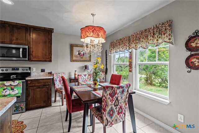 182 Palm, Spring Branch, TX 78070 - dining space featuring plenty of natural light, light tile patterned floors, and a chandelier