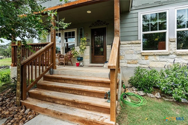 182 Palm, Spring Branch, TX 78070 - view of exterior entry with covered porch and stone siding
