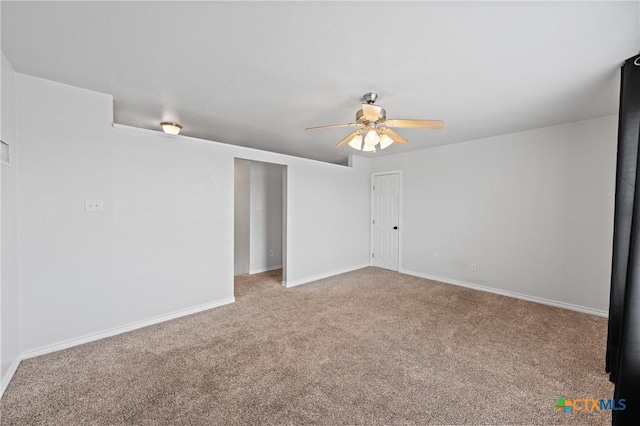 unfurnished room featuring ceiling fan and carpet floors