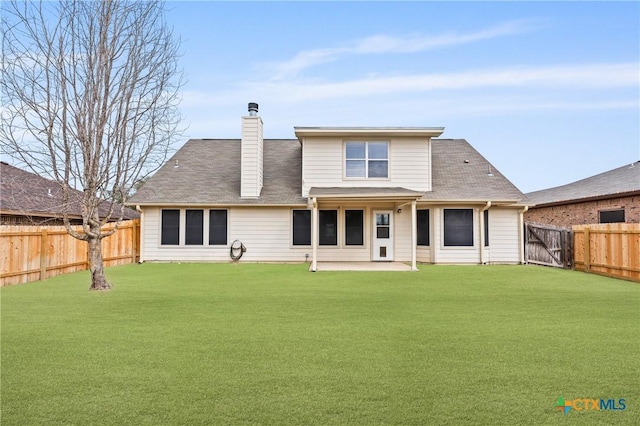 back of property featuring a patio area and a lawn