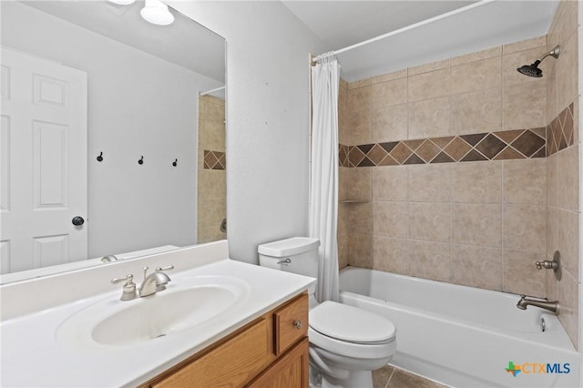 full bathroom with vanity, shower / tub combo, tile patterned floors, and toilet