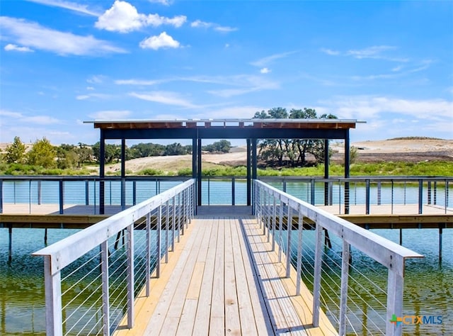 dock area with a water view