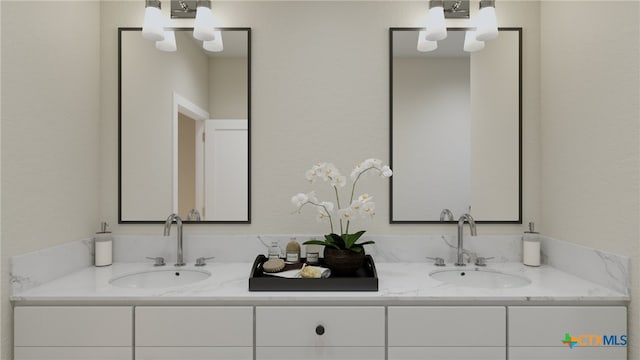 bathroom with vanity and a notable chandelier