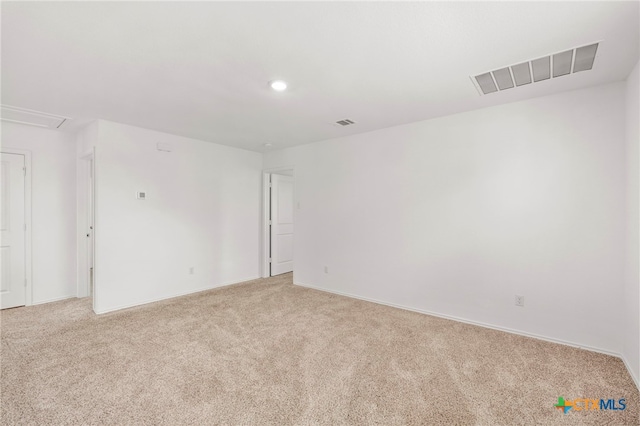 383 Soapstone Pass, San Marcos, TX 78656 - unfurnished room featuring light carpet, baseboards, recessed lighting, and attic access