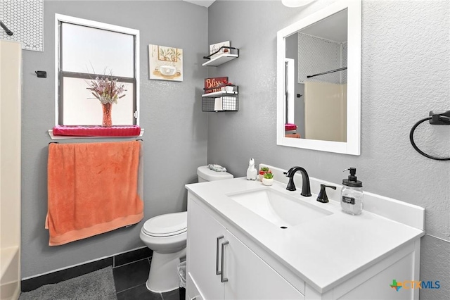 bathroom with vanity, tile patterned floors, and toilet