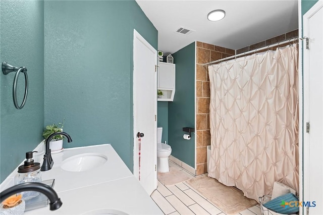 full bathroom featuring shower / bathtub combination with curtain, vanity, toilet, and tile patterned flooring