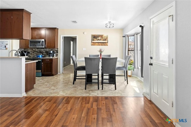 dining room featuring light wood-type flooring