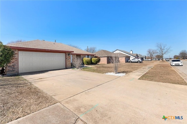 single story home featuring a garage