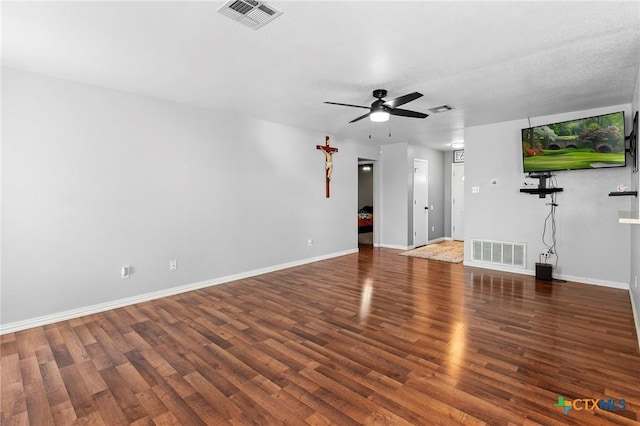 unfurnished living room with dark wood-type flooring and ceiling fan