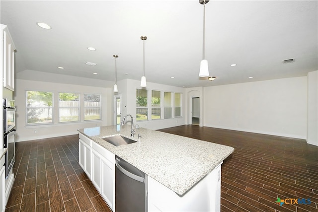 kitchen featuring white cabinetry, a wealth of natural light, appliances with stainless steel finishes, and sink