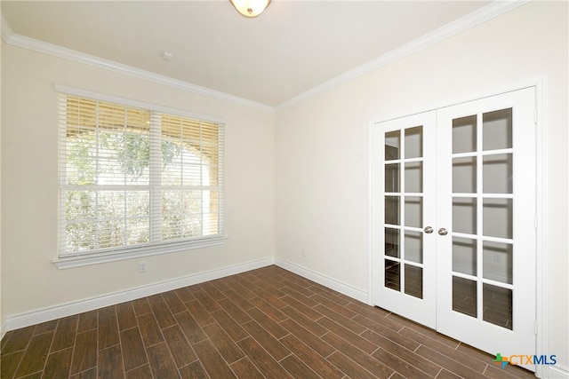 empty room featuring french doors, dark hardwood / wood-style floors, and crown molding