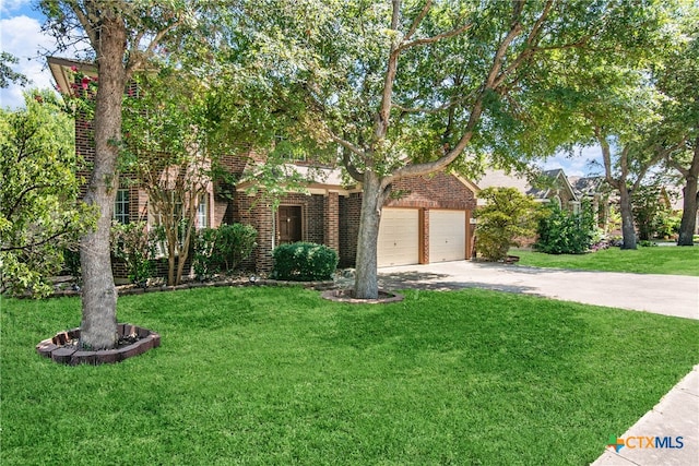 obstructed view of property featuring a garage and a front yard