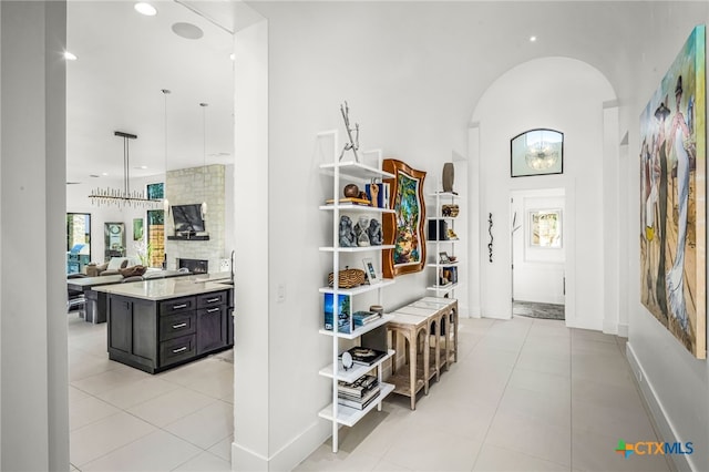 hall featuring light tile patterned flooring