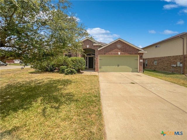 view of front of house featuring a garage and a front lawn