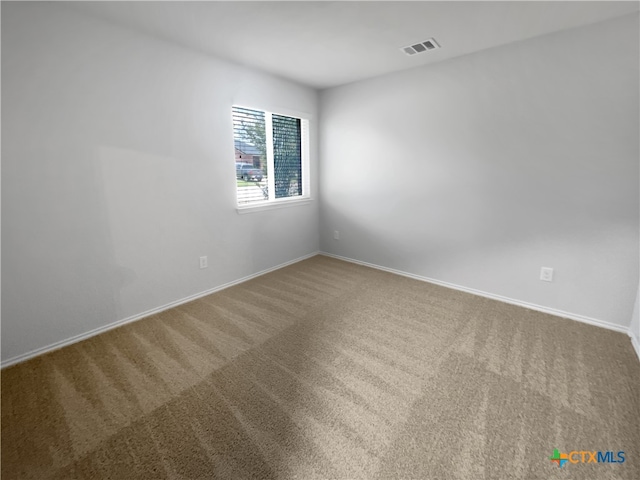 unfurnished room with carpet floors