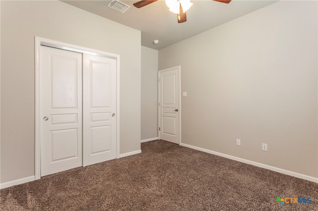 unfurnished bedroom featuring a closet, ceiling fan, and carpet floors