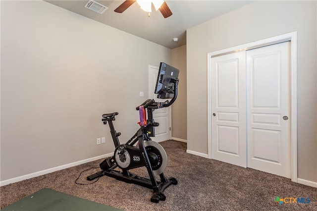 exercise area with ceiling fan and carpet