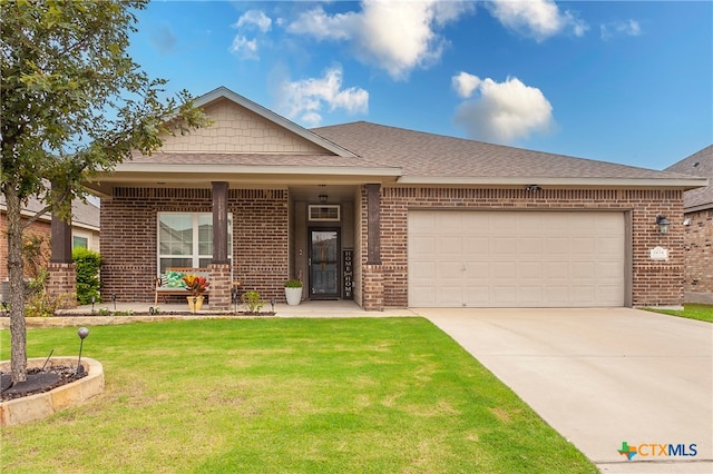 view of front of property with a garage and a front yard