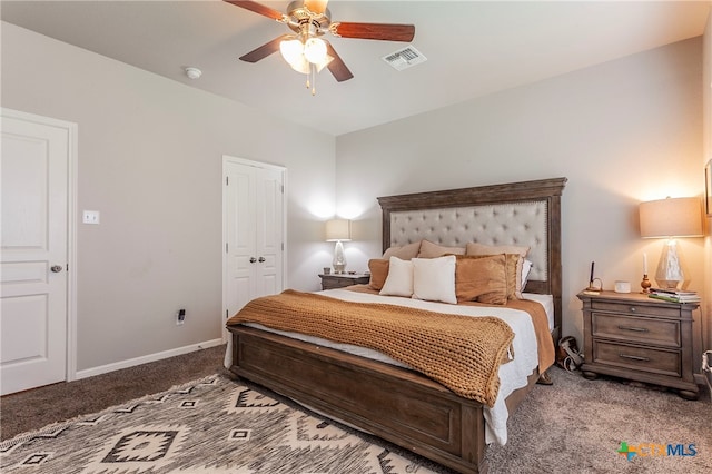 bedroom with a closet, ceiling fan, and carpet floors