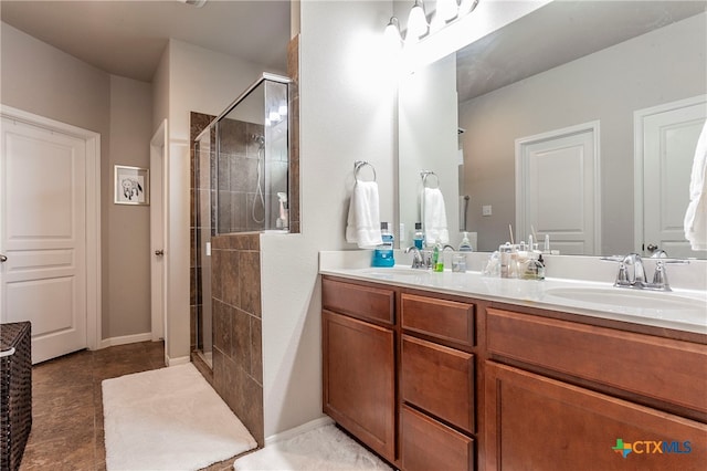 bathroom featuring vanity and a shower with door