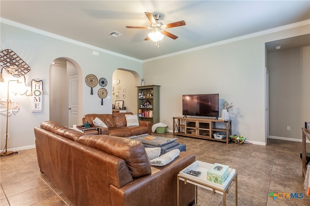 living room with ornamental molding, tile patterned flooring, and ceiling fan