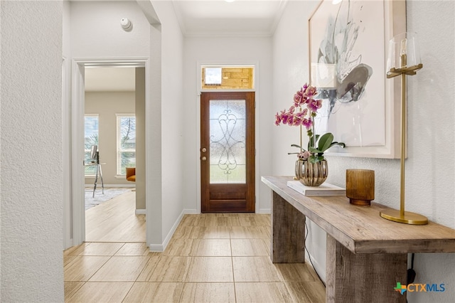 entrance foyer featuring crown molding