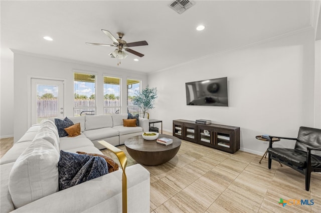 living room featuring ceiling fan and crown molding