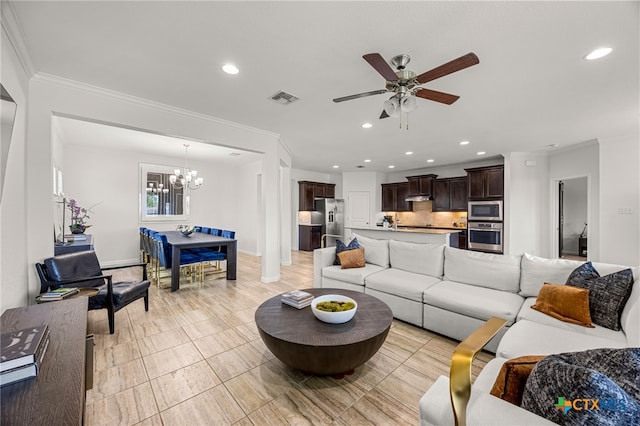 tiled living room featuring crown molding and ceiling fan with notable chandelier